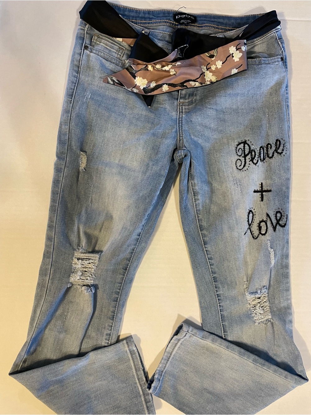 bebe Light Blue Distressed Boyfriend Jeans with Black Embroidered 'Peace + Love'